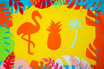 yellow paper with paper pineapple, flamingo and palm tree around jungle leaves, creative summer concept, jungle leaf, colorful background