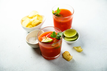 Homemade tomato cocktail with fresh lime
