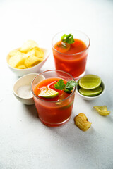 Homemade tomato cocktail with fresh lime