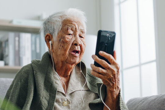 Asian senior woman grey hair 80-90s video call with doctor, telemedicine telehealth concept