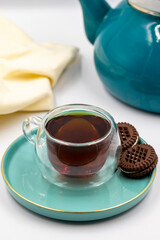 Black tea on a white background. Turkish tea brewed with hot water. close up