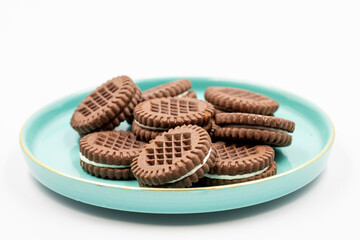Cocoa biscuits with cream filling on a white background. close up