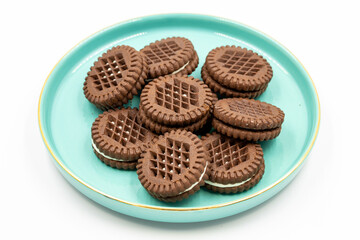 Cocoa biscuits with cream filling on a white background. close up
