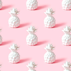 White pineapple tropical fruit repeat seamless pattern on light pastel pink background for wrapping paper.