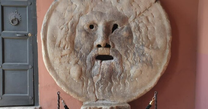 The Famous Marble Relic Of Bocca Della Verita In Santa Maria in Cosmedin church, Rome Italy - Tilt down close up shot