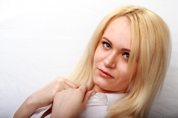 Closeup portrait of young beautiful woman blond girl with long straight hair with natural makeup....
