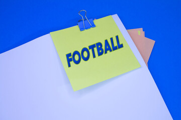 Football. Text on adhesive note paper. Event, celebration reminder message.