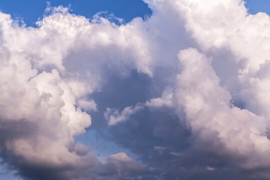 Epic Blue sky with big white fluffy cumulus storm clouds. Abstract background texture © Viktor Iden