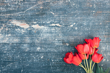 Fototapeta na wymiar Beautiful tulips on wooden background.