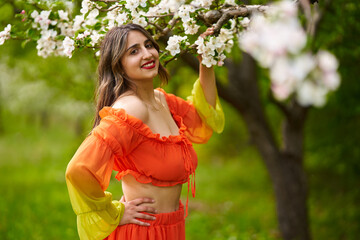 Young woman in apple orchard