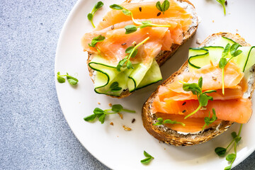 Open sandwich with cream cheese, salmon and cucumber.