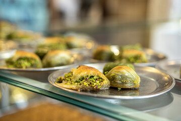 Traditional dessert called 'Baklava' on a gray vintage plate in a restaurant in the city of Gazinatep, close up