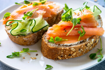 Open sandwich with cream cheese, salmon and cucumber.