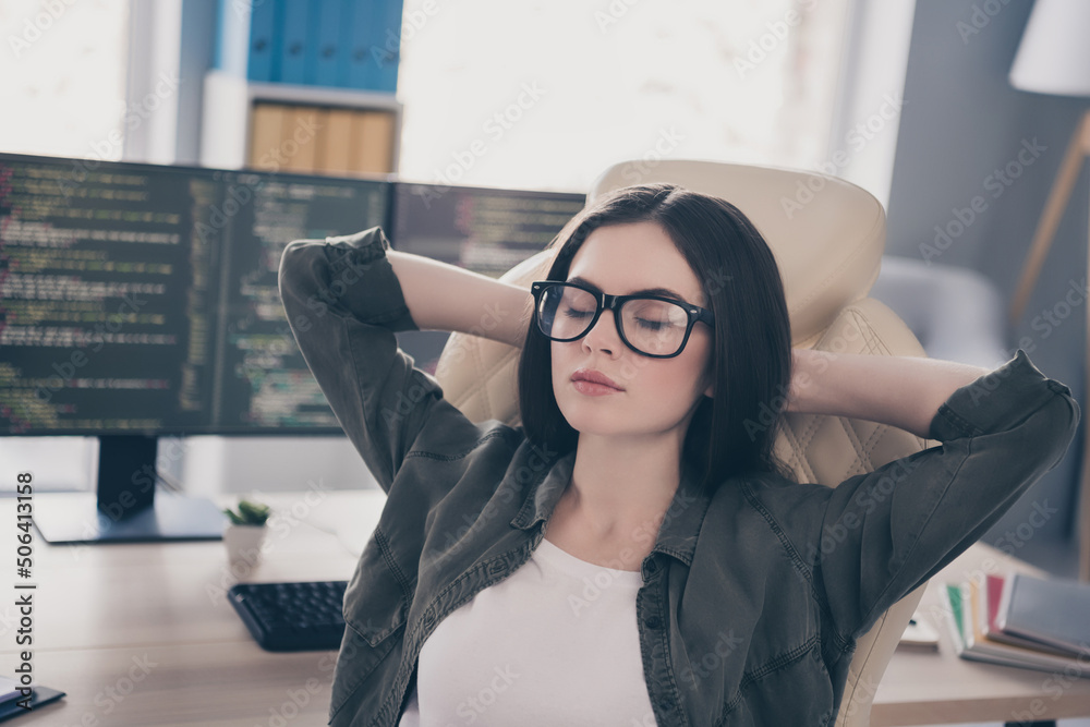 Poster portrait of attractive dreamy girl tech support geek junior web developer resting in chair at workpl