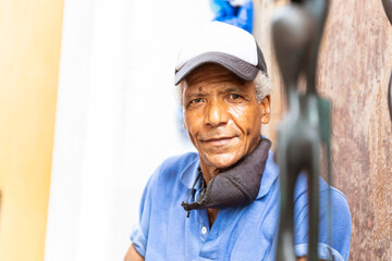 portrait of an afro american carver man in the street