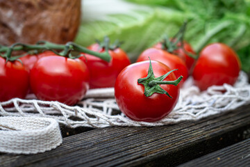 Close-up of tomatoes on a wooden surface.