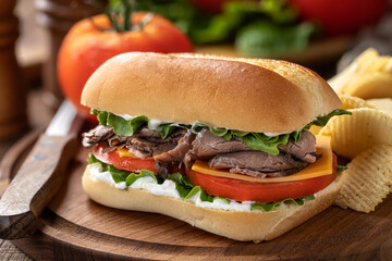 Roast beef sandwich with cheese, tomato and lettuce