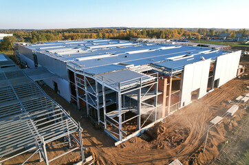 Warehouse Construction from metal structure. Industrial building on light gauge steel framing....