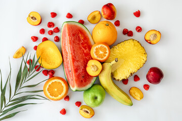 Tropical fruits on a white background top view.