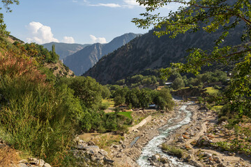 Fototapeta na wymiar View over Bamboret river and Kalash valley in a sunny day, Chitral, Hindukush, Pakistan