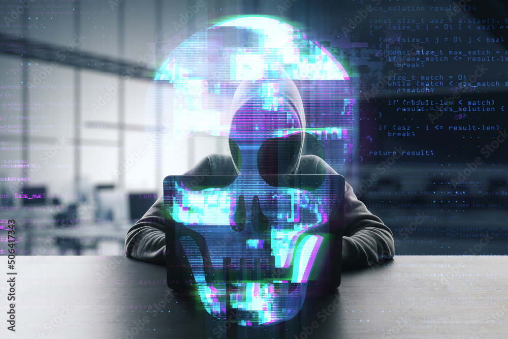 Fototapete Front view of hacker at desktop using laptop computer keyboard with abstract digital skull hologram on blurry office interior background. 