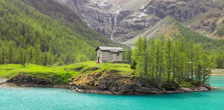 Amazing view on the blue lake between Alp mountains. Summer day, Switzerland. Alp Grum Lake, Graubunden. Bernina express