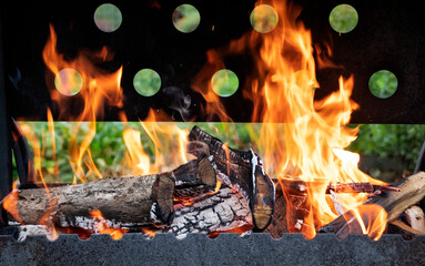 cast-iron brazier with burning firewood in the village. BBQ