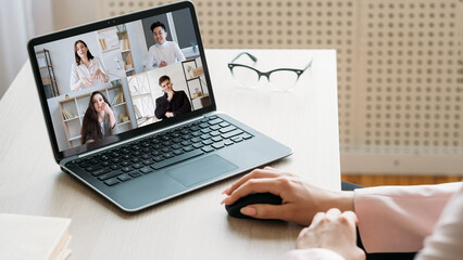 Video conference. Remote business. Telecommuting network. Female executive discussing strategy online with diverse team on laptop screen at home office with free space.