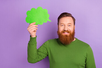 Portrait of good mood positive young male brainstorming generating new ideas isolated on purple...