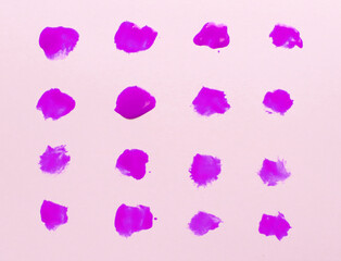 Abstract pink paint drops brushes isolated on white