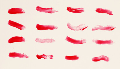 Abstract red nail polish smear brushes isolated on white