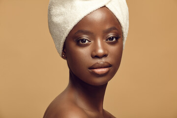 Headshot close up portrait of beautiful African American woman having healthy and clean skin tone...