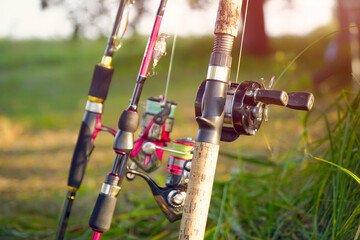 Spinning rods with reels and lures ready for fishing - obrazy, fototapety, plakaty