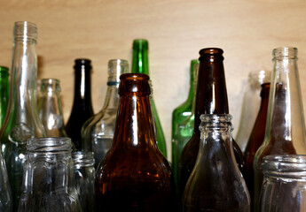 Glass waste for recycle. Empty glass bottles from beer wine and champagne. Ecology and environment concept. Glass bottle recycle. Glass bottles for reuse. Bottles waste reusable material.
