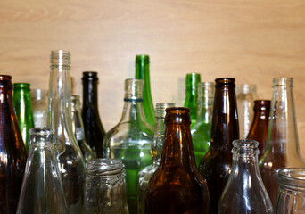 Glass waste for recycle. Empty glass bottles from beer wine and champagne. Ecology and environment concept. Glass bottle recycle. Glass bottles for reuse. Bottles waste reusable material.