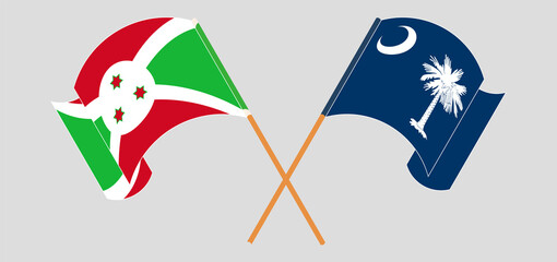 Crossed and waving flags of Burundi and The State of South Carolina