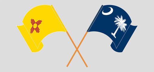 Crossed and waving flags of the State of New Mexico and The State of South Carolina