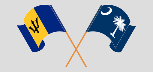 Crossed and waving flags of Barbados and The State of South Carolina