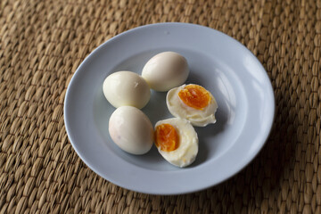boiled eggs in a blue plate,Include Clipping Path.