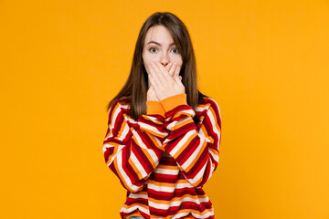 Young sad caucasian shocked surprised sad astonished woman 20s in red striped sweatshirt cover...