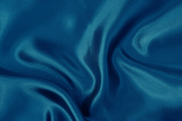 Dark blue fabric cloth texture for background and design art work, beautiful crumpled pattern of silk or linen.