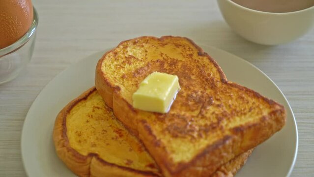 French toasted with butter and honey for breakfast