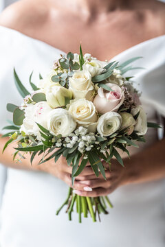 Wedding flowers bouquet held by a bride during her special day