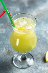 Cocktail with kiwi and mint in a glass. Summer cold drink. Mojito cocktail or non-allcohol mocktail. vertical image. top view. place for text