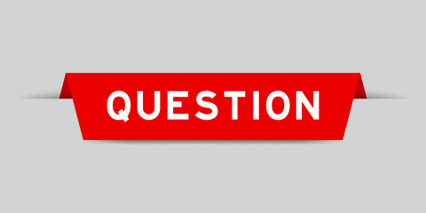 Red color inserted label with word question on gray background