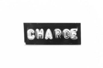 Black color banner that have embossed letter with word charge on white paper background