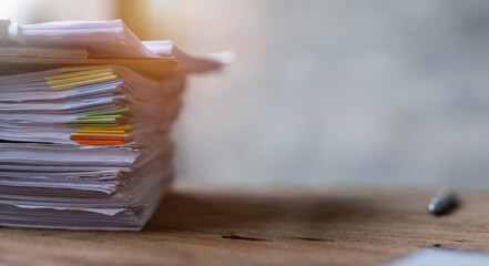 Document, a Stack of documents with a paper clip folder placed on a business desk in a business...