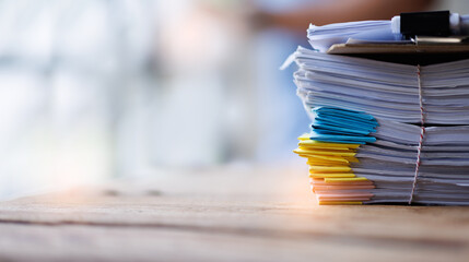 Fototapeta Document, a Stack of documents with a paper clip folder placed on a business desk in a business office. obraz