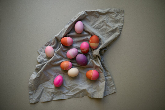 colourful Easter eggs on grey fabric