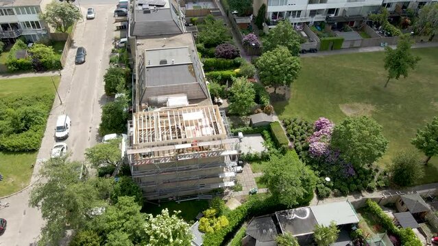 Aerial overview of wooden frame of roof structure under construction